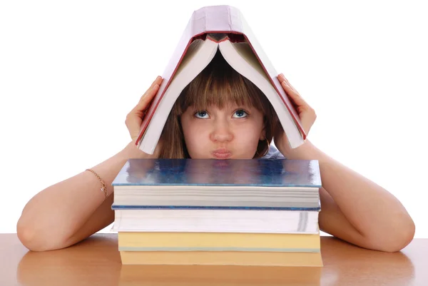 Dziewczyna trzyma czerwony książki na głowę — Zdjęcie stockowe