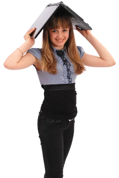 Chica sostiene el portátil en una cabeza —  Fotos de Stock