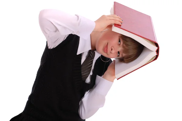 Mädchen hält das aufgeschlagene Buch auf dem Kopf — Stockfoto