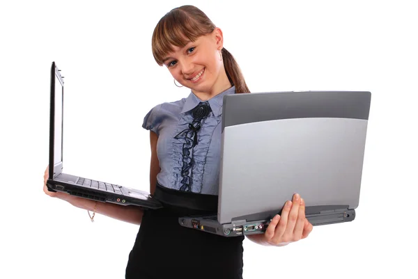 Jenta har to bærbare datamaskiner. – stockfoto
