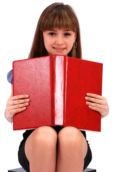 Menina segura o livro aberto — Fotografia de Stock