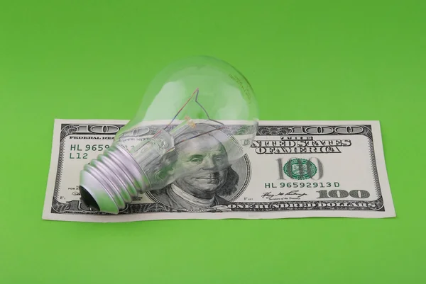 Electric lamp on hundred dollars — Stok fotoğraf