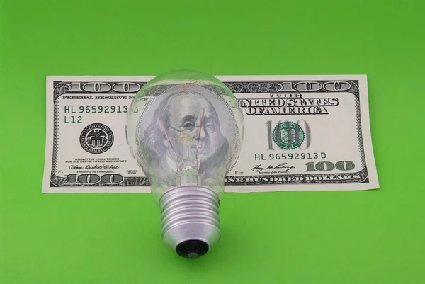 Electric lamp on hundred dollars — Stockfoto