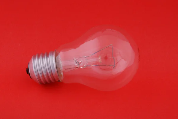 Light Bulb Red Background — Stock Photo, Image