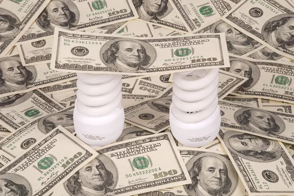 Two Luminescent Lamps Background Dollars — Stock Photo, Image