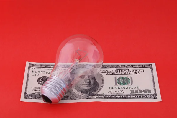 Electric lamp on hundred dollars — Stok fotoğraf