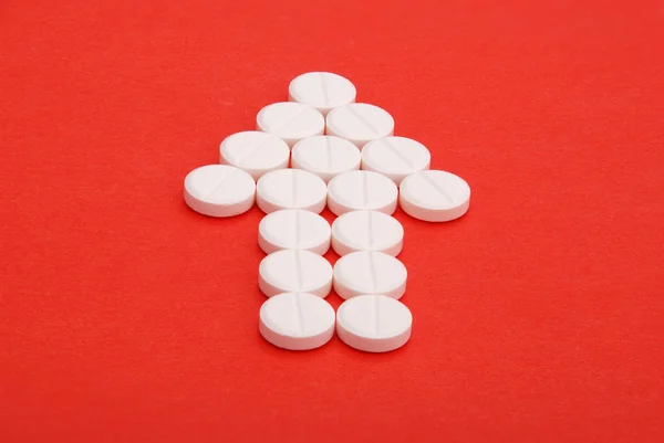 Pfeil Der Pillen Auf Rotem Hintergrund — Stockfoto