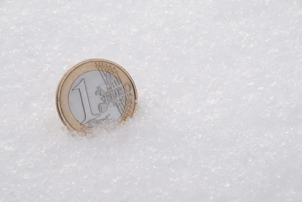 stock image The lost coins on a snow. One Euro