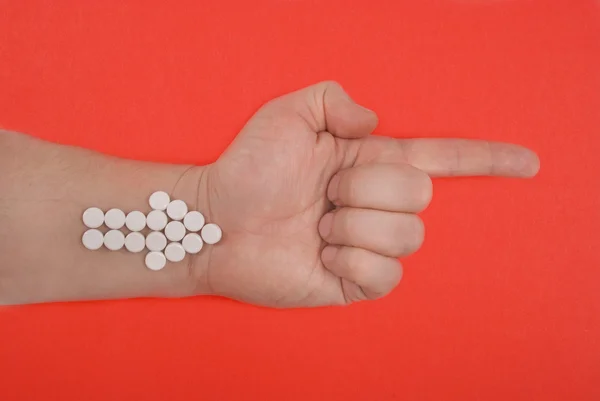 Der Pfeil wird aus weißen Tabletten kombiniert. — Stockfoto