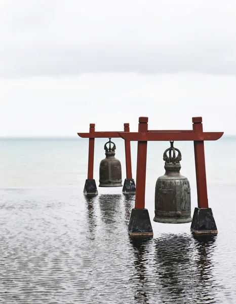 stock image Two old large bells in water