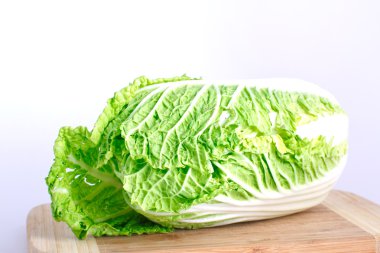 Fresh cabbage on the wood desk clipart