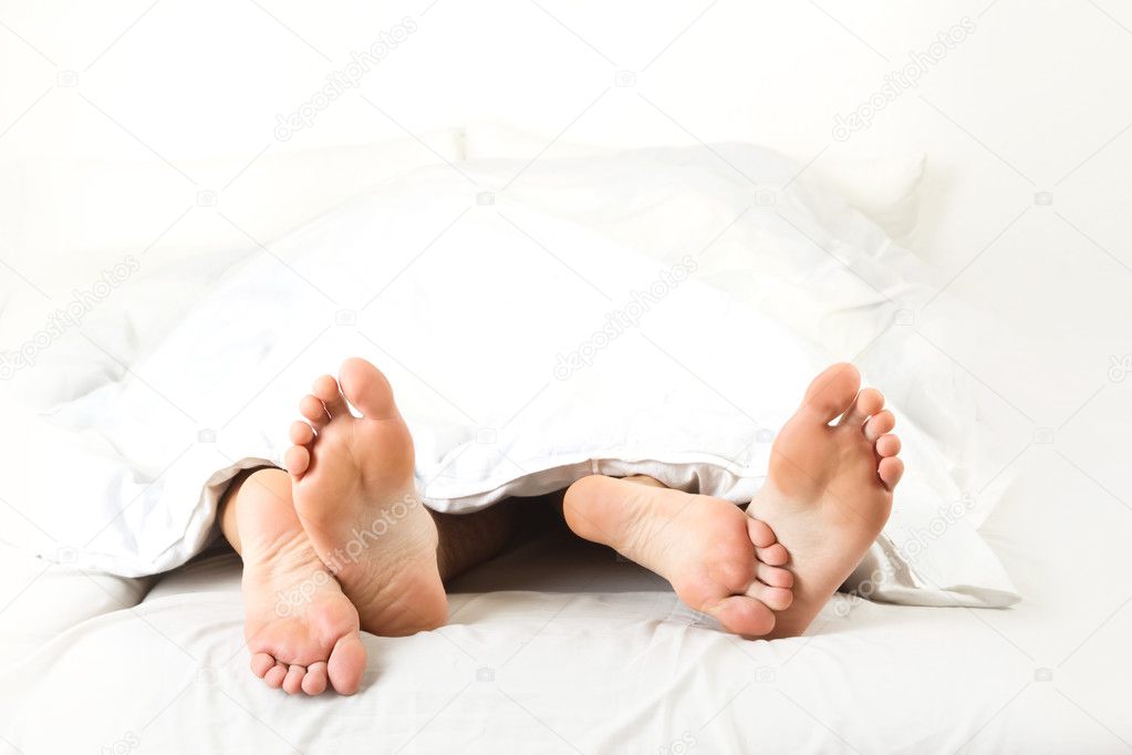 Foot of two in the bedroom, on white background