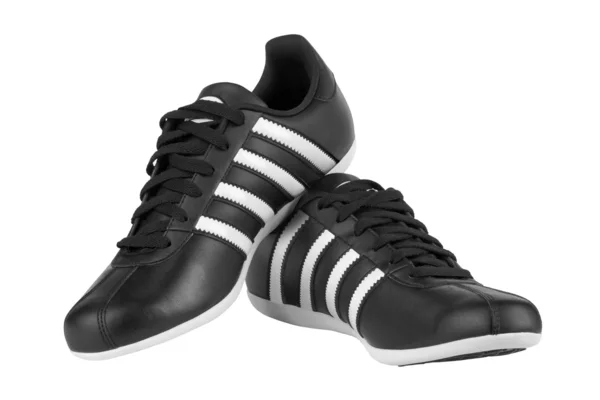 Fehér csíkok fekete cipők — Stock Fotó