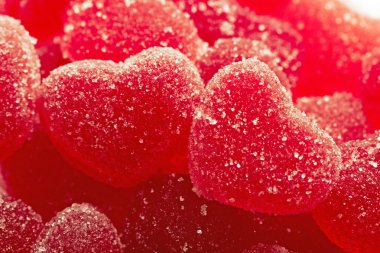 Red fruit candy in the form of the heart clipart