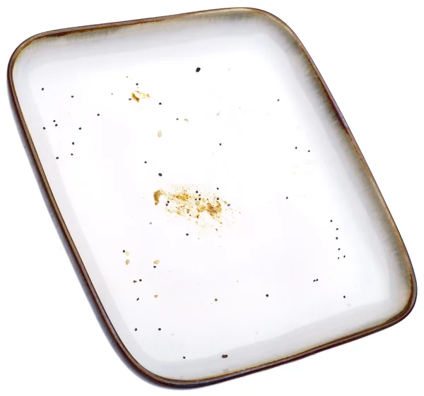 Пустая тарелка с крошками — стоковое фото