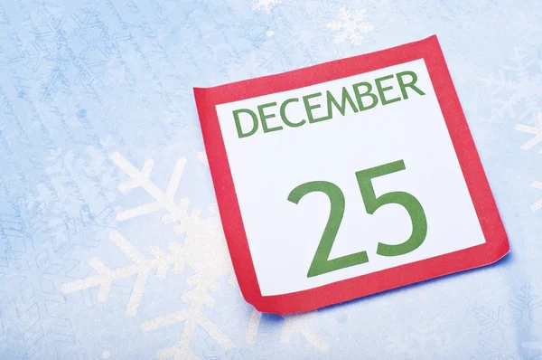 Pagina del calendario natalizio su sfondo fiocco di neve — Foto Stock