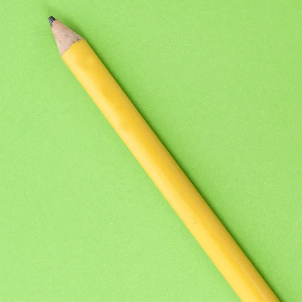 School Pencil on Vibrant Green — Stock Photo, Image