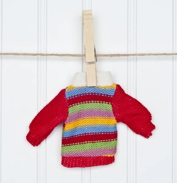 Warm Winter Striped Sweater on a Clothesline — Stock Photo, Image