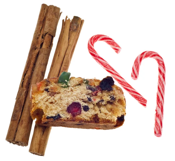 De cake van het voedsel kaneel fruit van de vakantie en candy cane snoepjes — Stockfoto