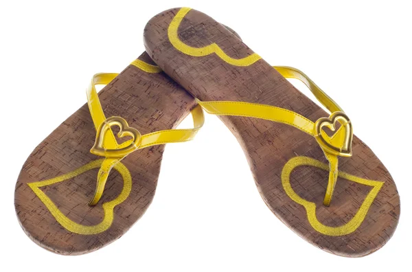 Желтые сандалии с сердечками — стоковое фото