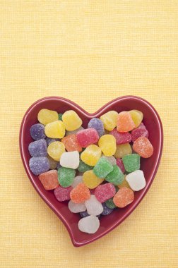 Candy Spice Drops in a Red Heart Shaped Bowl clipart