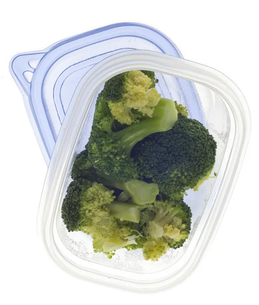 Brokkoli Reste Einem Plastikbehälter Auf Weißem Papier — Stockfoto