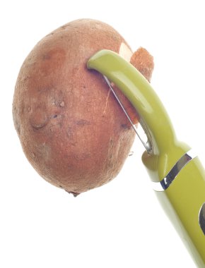 Sweet Potato Being Peeled clipart