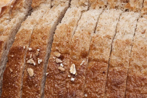 セレクティブ フォーカスと新鮮なスライスされたパンの背景 — ストック写真
