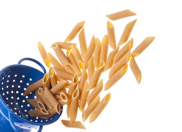 Whole Wheat Pasta Spilling Vibrant Blue Colander Border Image — Stock Photo, Image