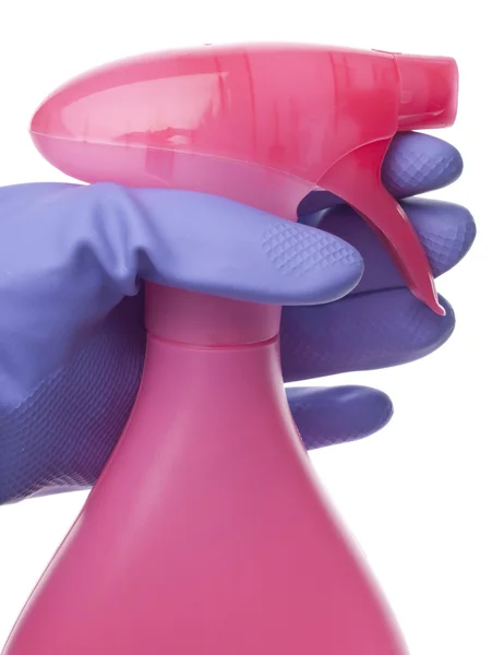 Ροζ φορημένο γάντια χέρι σε μπουκάλι σπρέι καθαρισμού έννοια — Φωτογραφία Αρχείου