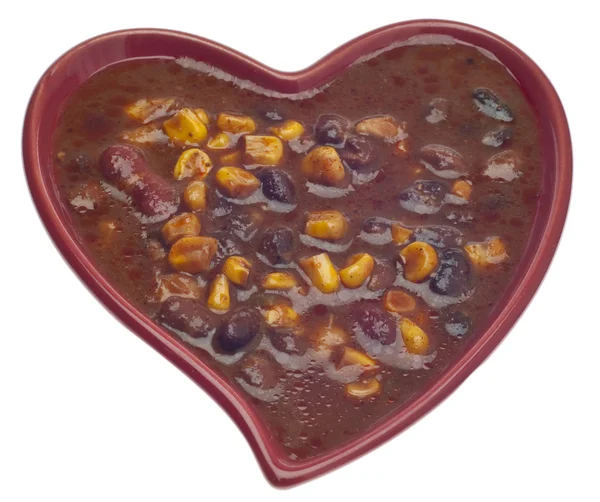 Svarta bönor dopp i en hjärtformade skål — Stockfoto