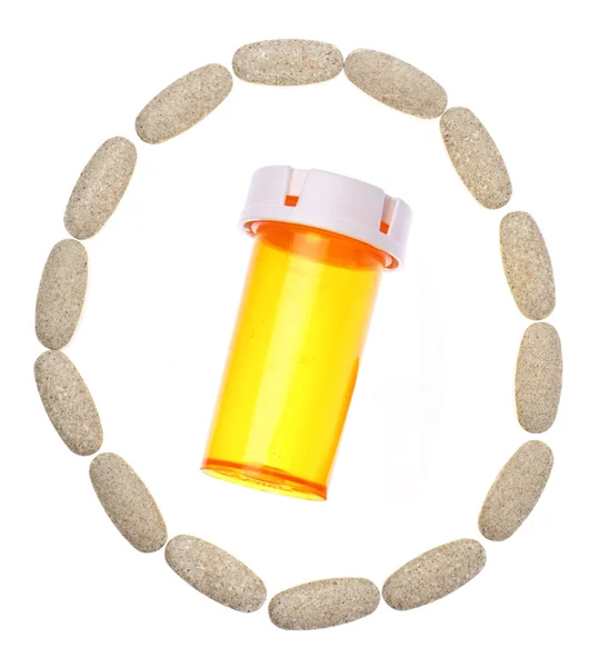 Círculo de pastillas Cápsulas con frasco de prescripción en el centro —  Fotos de Stock