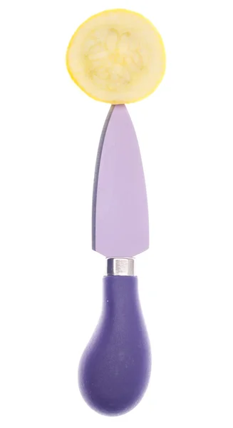 Gelber Kürbis auf lila Messer — Stockfoto