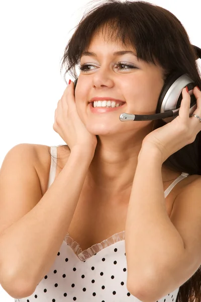 Woman in white dress with headset Royalty Free Stock Images