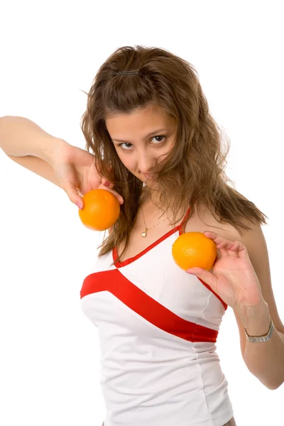 Vrouw met sinaasappelen Stockfoto