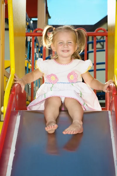 Little cheerful girl going down — Stock Fotó