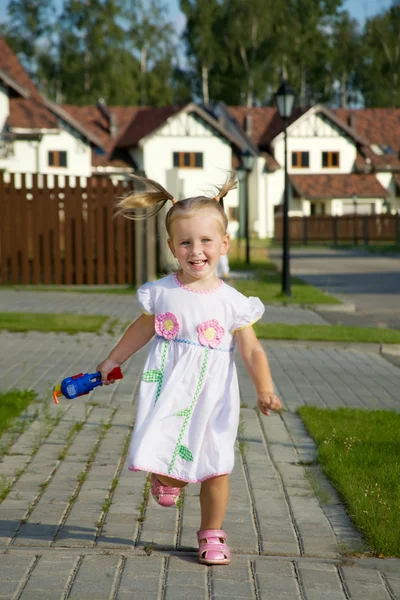 Running little cheerful girl — Stock Photo, Image