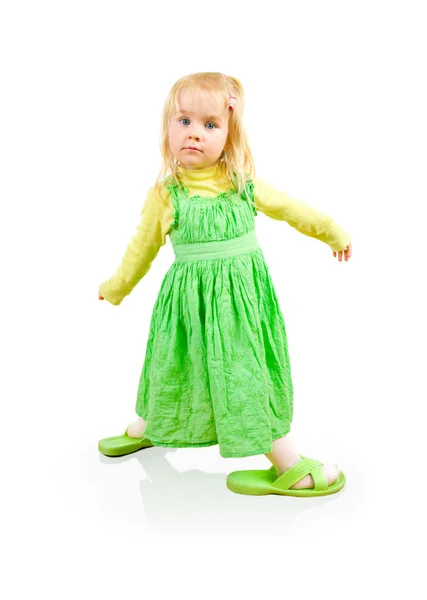 Beautiful little girl with big slippers — Stock Photo, Image