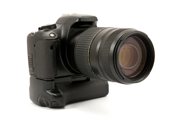Camera with battery grip and lens — стоковое фото