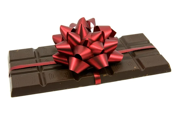 Chocolate with red ribbon — Stock Photo, Image
