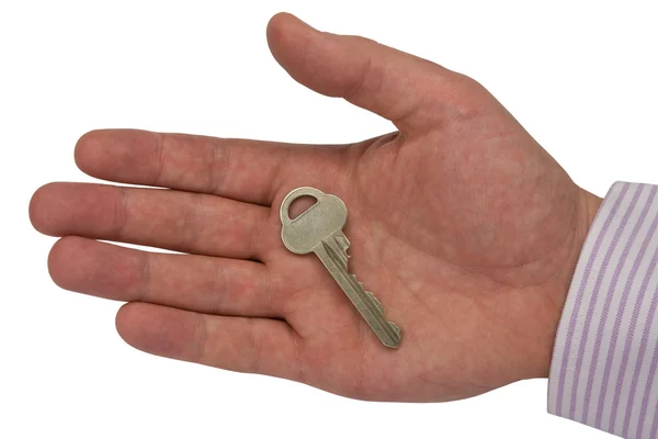 Metal key in hand — Stock Photo, Image