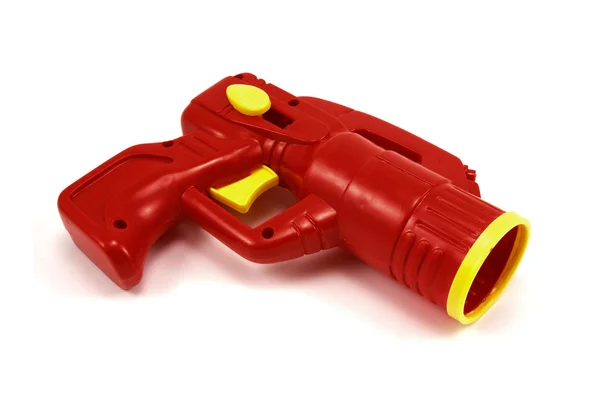 Красный пластиковый пистолет — стоковое фото