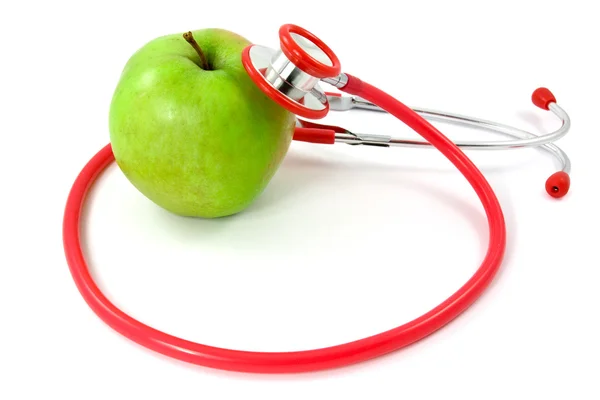 Здоровый apple и стетоскоп — стоковое фото