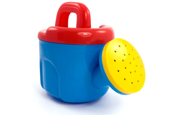 Child's plastic colorful watering-can — Stock Photo, Image