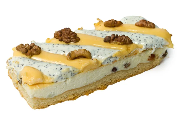 Piece of cake with walnut, cream, poppy and raisins. — Stock Photo, Image