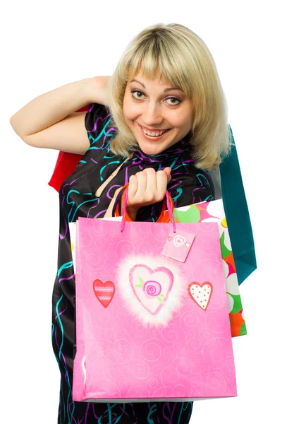 Mooi meisje met kleurrijke pakketten. — Stockfoto