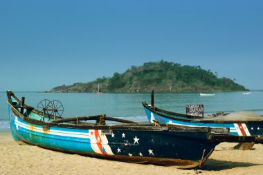 Traditional boats at the beach of Goa state, India clipart