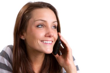 Happy young woman talks on her cellphone. clipart