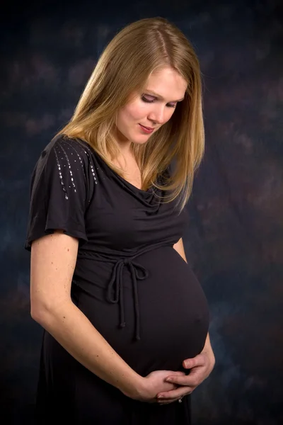 Blonde Expectant Mother Third Trimester Pregnancy Holds Her Abdomen Looks — Stock Photo, Image