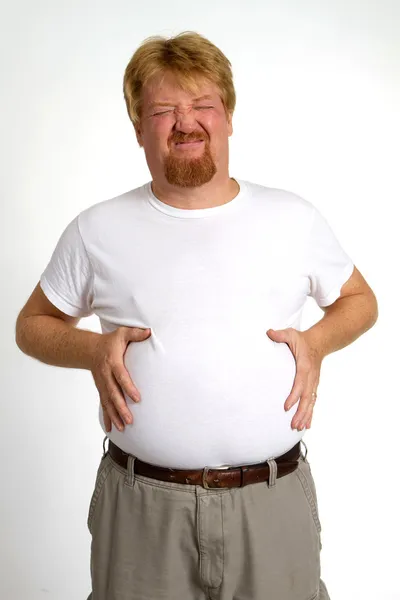 Übergewichtiger Mann mit Verdauungsstörungen — Stockfoto